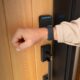 Person unlocking Schlage Sense Pro with Apple Watch