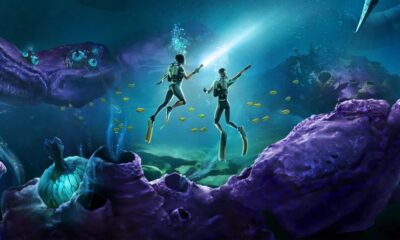 Subnautica 2 header keyart – two divers pointing off to the distance underwater