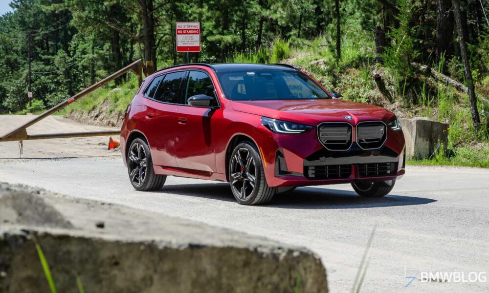 2025 BMW X3 M50 FIRE RED three quarter front view