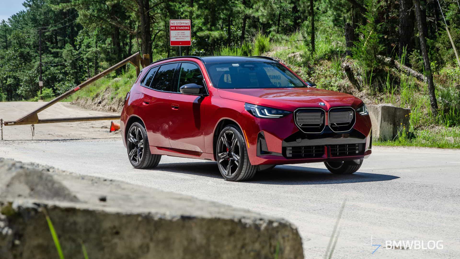2025 BMW X3 M50 FIRE RED three quarter front view