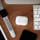 Apple products on desk AirPods Keyboard Apple Watch