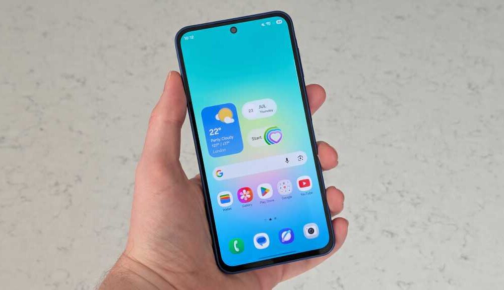 A hand holding the Samsung Galaxy A27 with its screen on