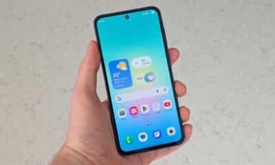 A hand holding the Samsung Galaxy A27 with its screen on
