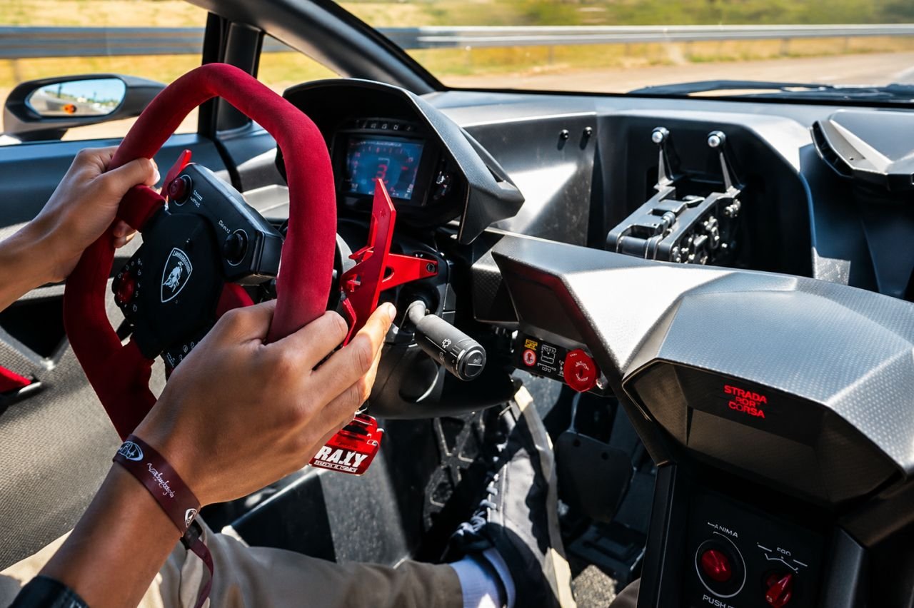 Riding shotgun in a Lamborghini Sesto Elemento at Laguna Seca