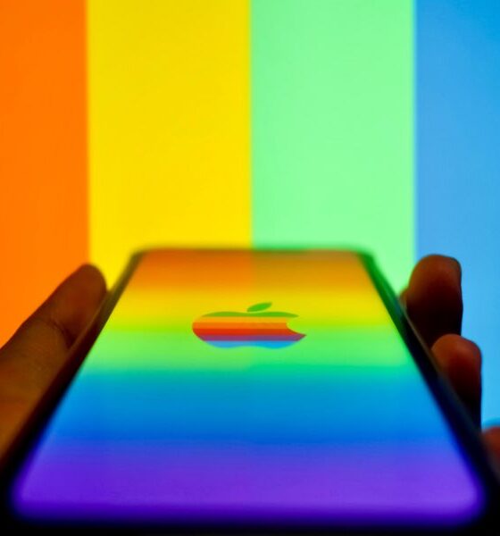 iPhone with rainbow Apple logo against test pattern