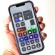 Control center in hand holding iphone 13 isolated on white background