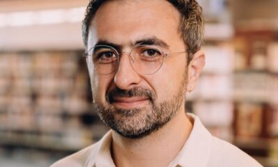 Photo of Microsoft AI CEO Mustafa Suleyman as he warns that Anthropic risks AI alignment failures by training Claude to view itself as a conscious entity deserving of legal rights.