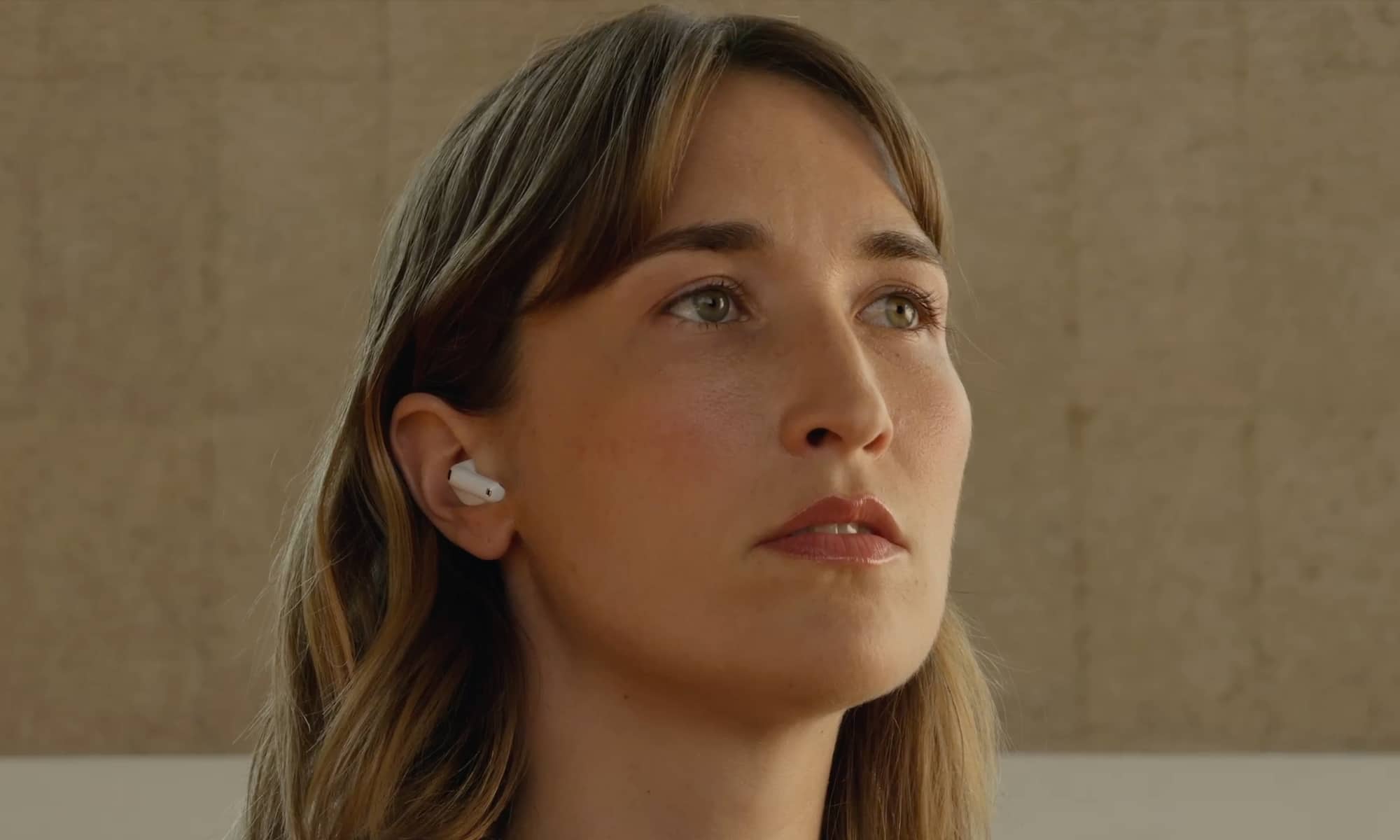 Woman wearing AirPods 5.