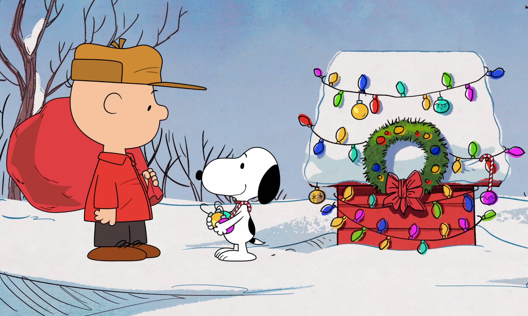 Image of Charlie Brown and Snoopy standing by the decorated doghouse in '12 Days of Snoopy'