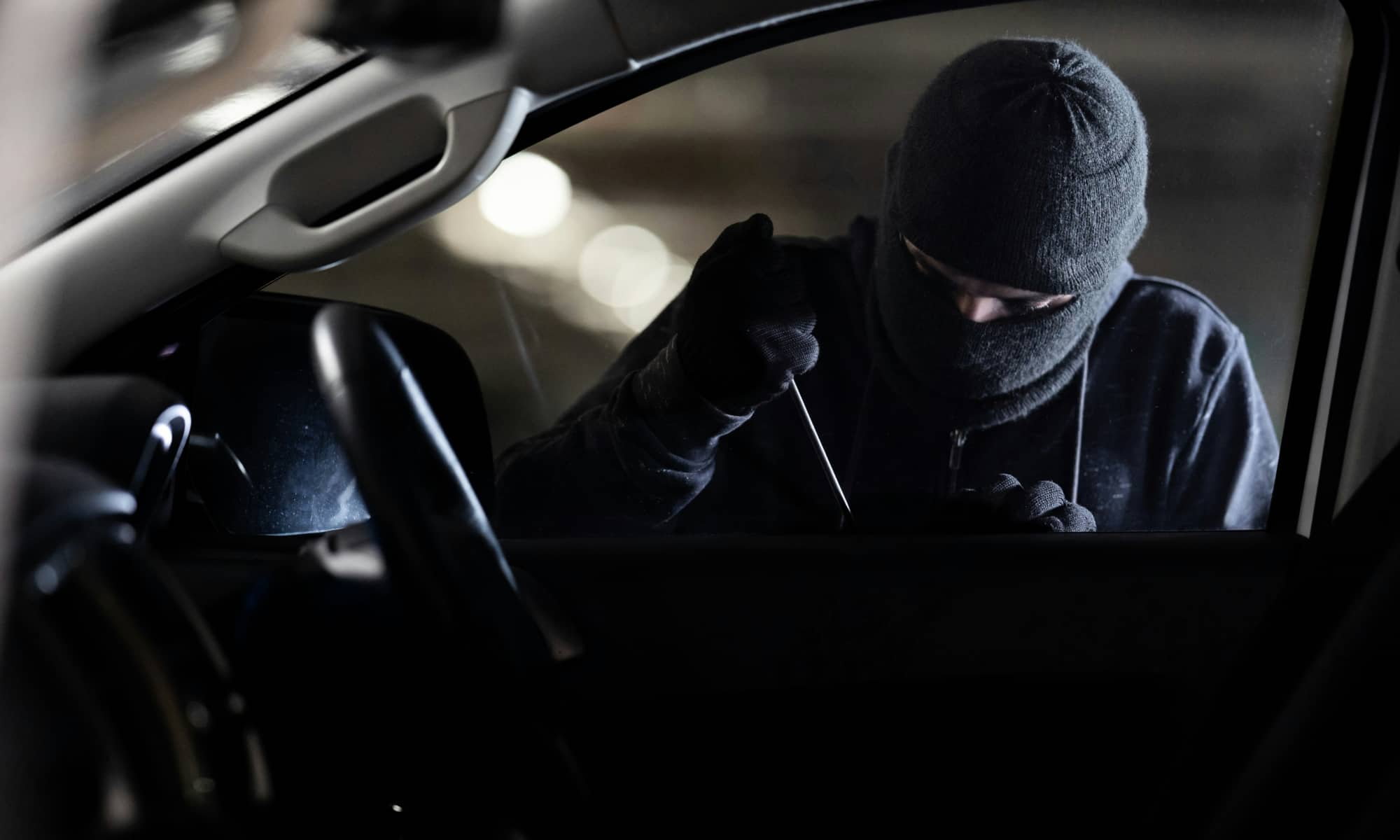 crime log masked man breaking into car