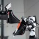 XDOF's robotic arms manipulate a pen and cap.