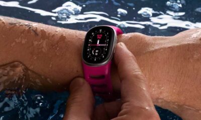 Google Fitbit Edge fitness tracker in a swimming pool