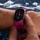 Google Fitbit Edge fitness tracker in a swimming pool